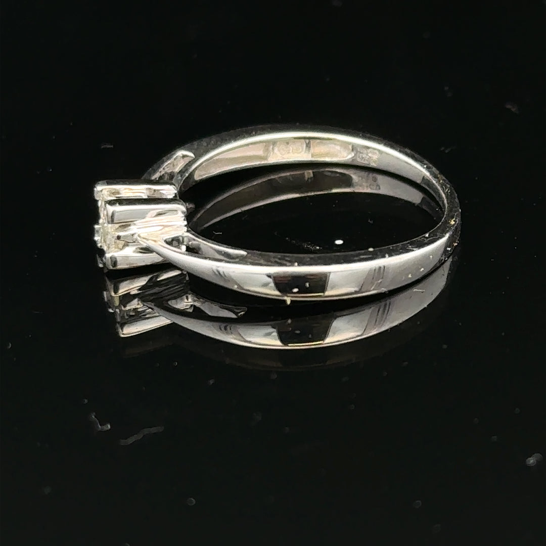9ct white gold diamond ring with sparkling stones, showcasing elegant craftsmanship and a classic design.