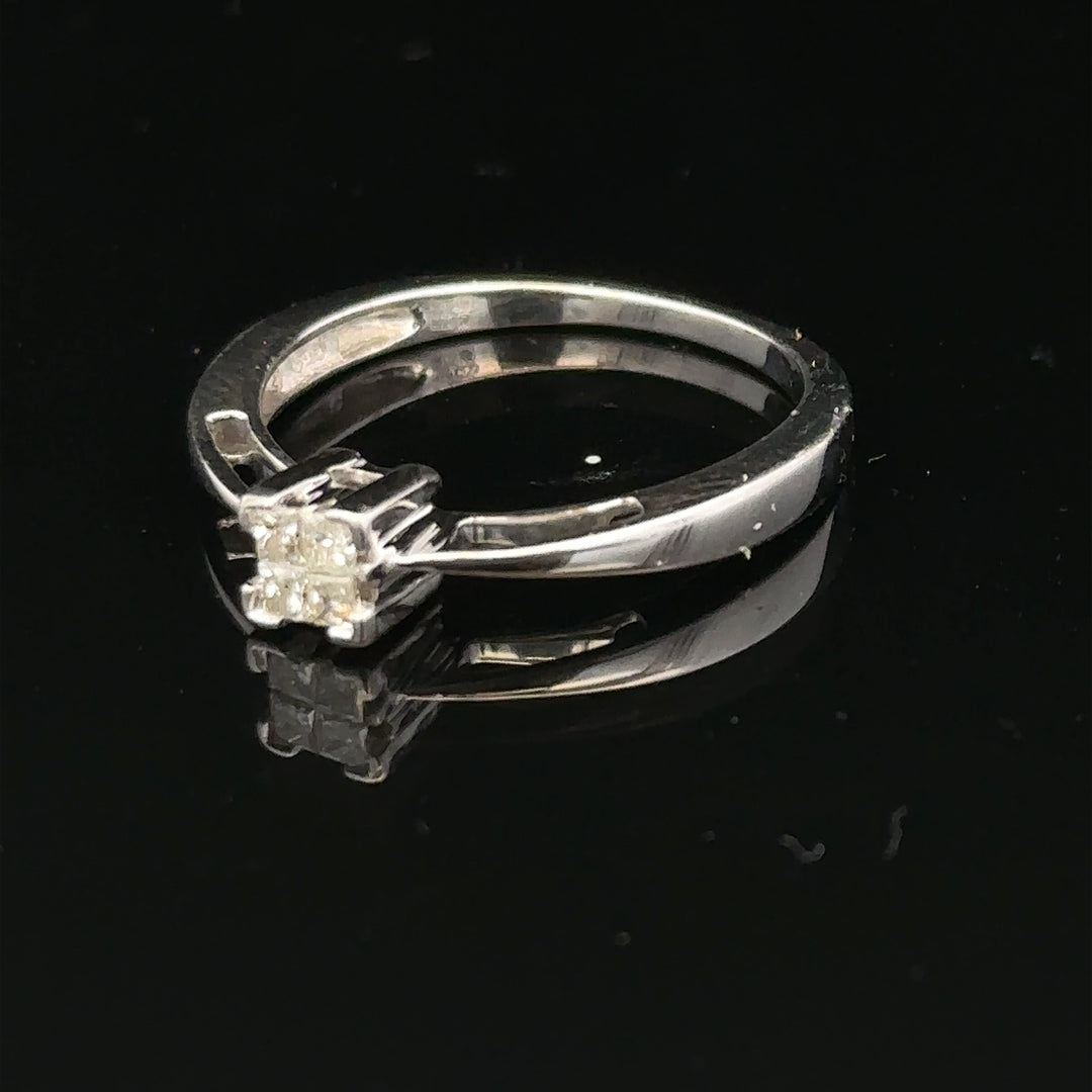 9ct white gold diamond ring with sparkling diamonds set around the band, showcasing elegant jewelry design.
