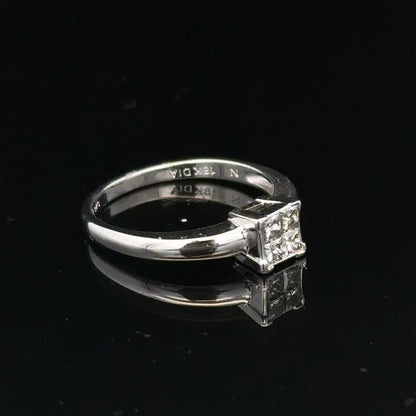 18ct white gold diamond ring with small sparkling diamonds, size J1/2, elegant jewelry piece.