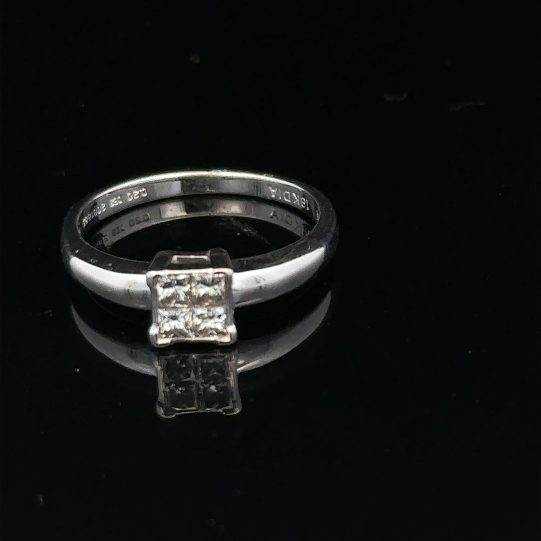 18ct white gold diamond ring with a solitaire design, size J1/2, featuring sparkling diamonds on a sleek band.
