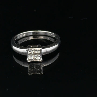 18ct white gold diamond ring with a solitaire design, size J1/2, featuring sparkling diamonds on a sleek band.