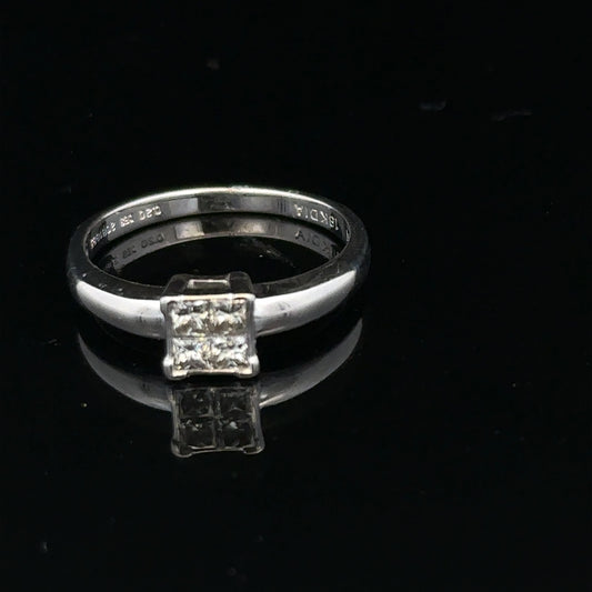18ct white gold diamond ring with a solitaire design, size J1/2, featuring sparkling diamonds on a sleek band.