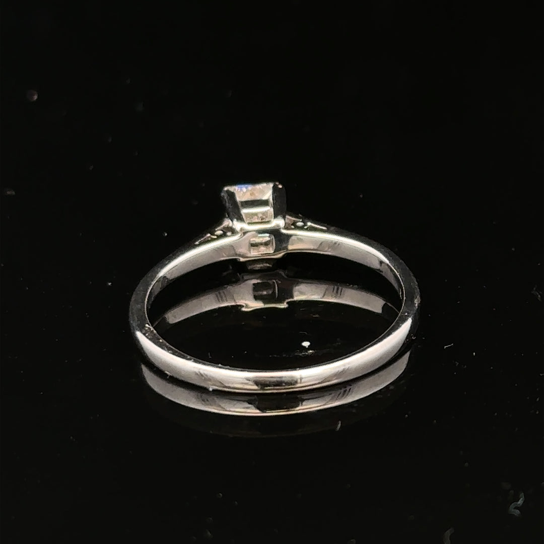 18ct yellow gold diamond ring with a 1/3 carat princess cut diamond, size M, featuring a sleek and elegant design.