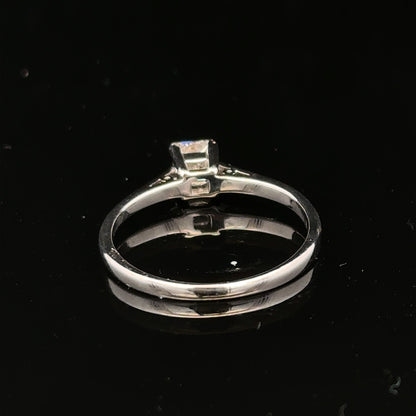 18ct yellow gold diamond ring with a 1/3 carat princess cut diamond, size M, featuring a sleek and elegant design.