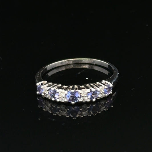9ct white gold diamond ring in size P by Reeves and Sons, showcasing a sparkling diamond set in a sleek band.