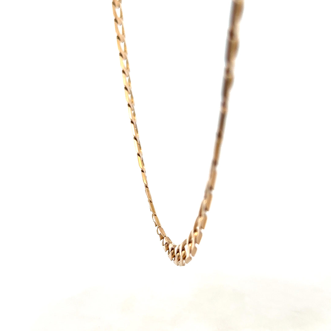 9ct yellow gold curb chain weighing 27.6g with detailed links, crafted by Reeves and Sons.