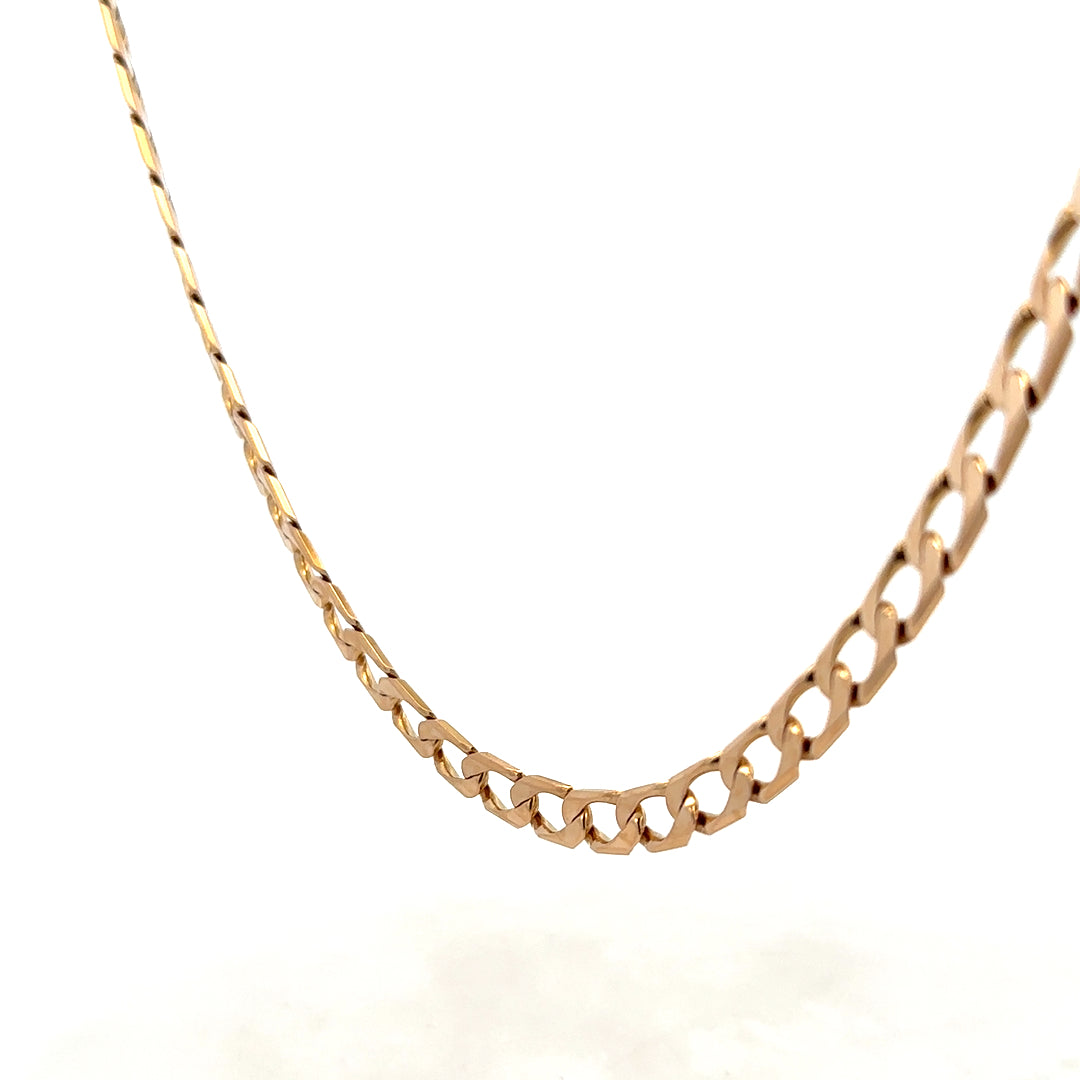 9ct yellow gold curb chain weighing 27.6g with detailed links, crafted by Reeves and Sons.