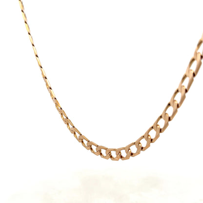 9ct yellow gold curb chain weighing 27.6g with detailed links, crafted by Reeves and Sons.