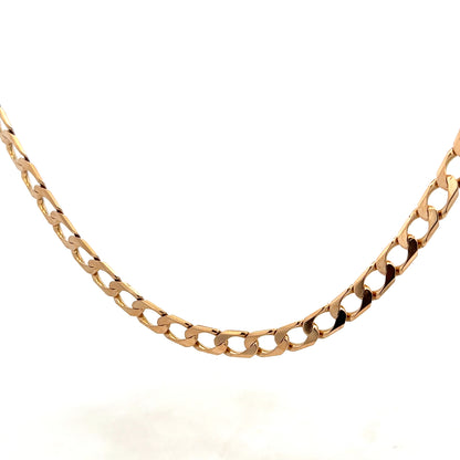 9ct yellow gold curb chain weighing 27.6g, featuring interlocking oval links, crafted by Reeves and Sons.