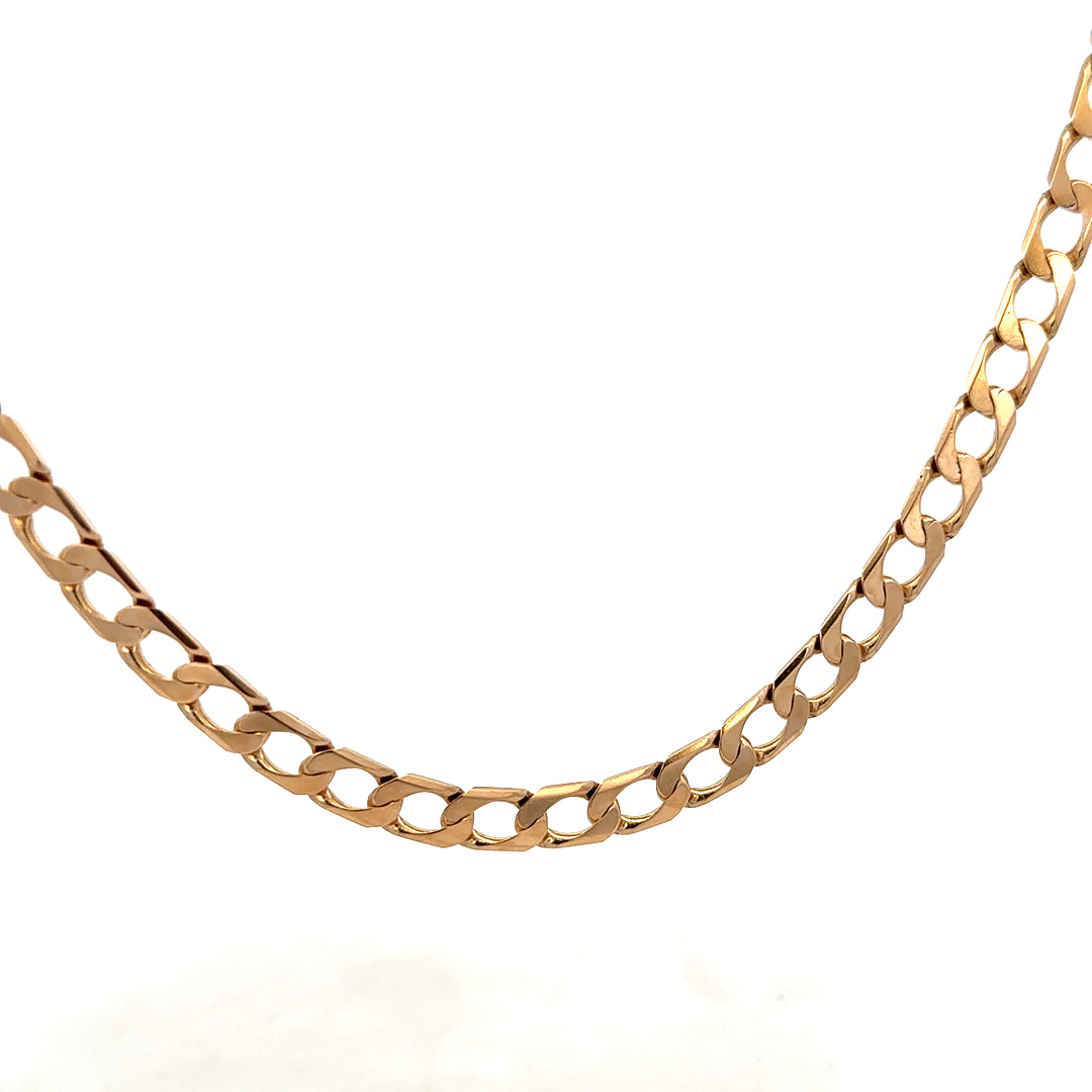 9ct yellow gold curb chain weighing 27.6g, featuring thick, interlocking links, crafted by Reeves and Sons.