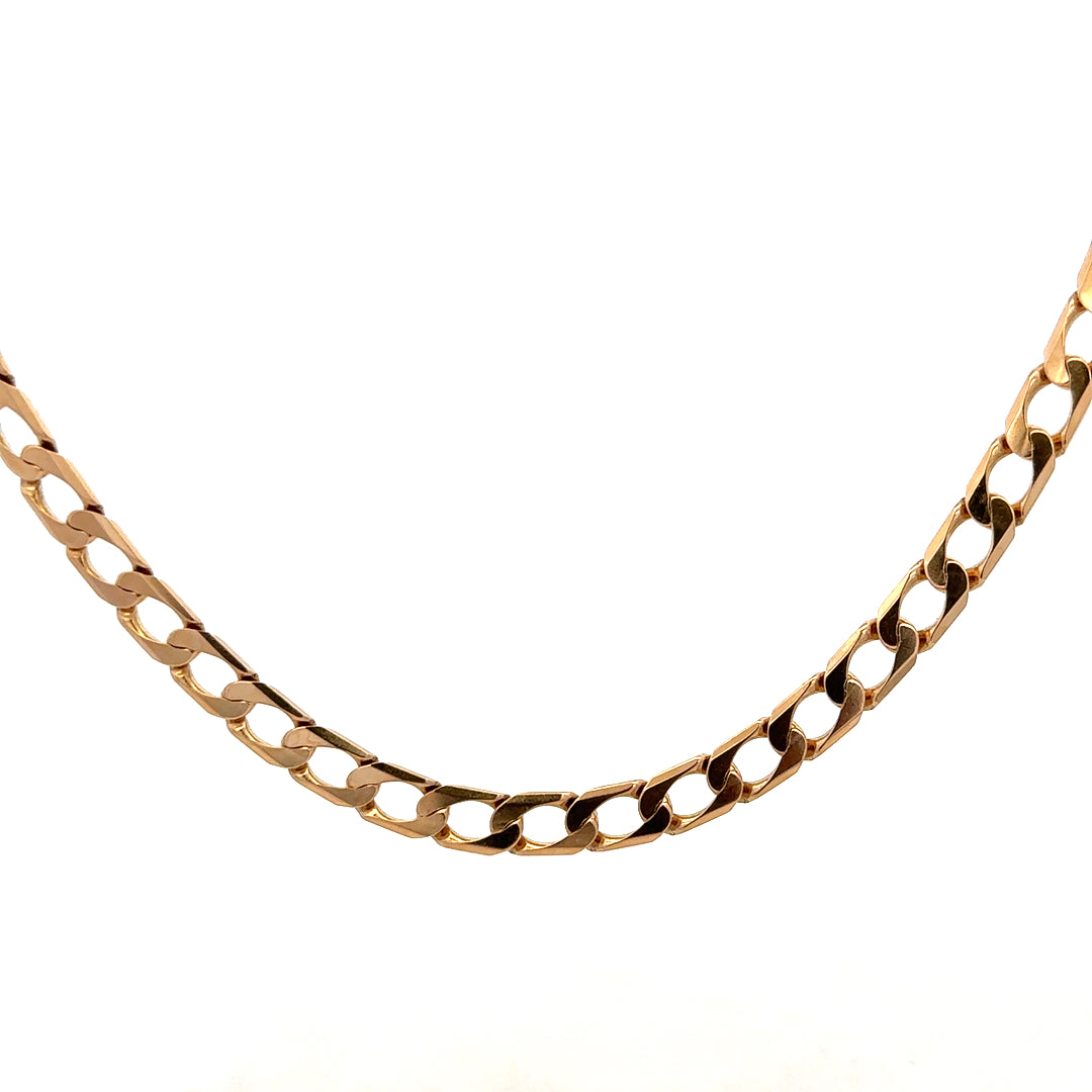 9ct yellow gold curb chain weighing 27.6g, featuring interlocked flat links, crafted by Reeves and Sons.