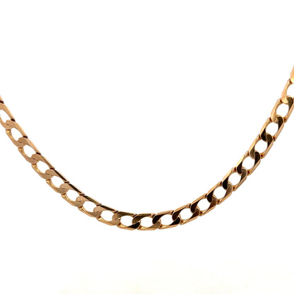 9ct yellow gold curb chain weighing 27.6g, featuring interlocked flat links, crafted by Reeves and Sons.