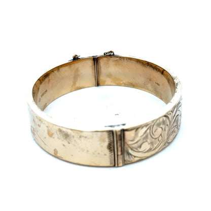 9ct yellow gold bangle weighing 22.7g with a smooth, polished finish, crafted by Reeves and Sons.