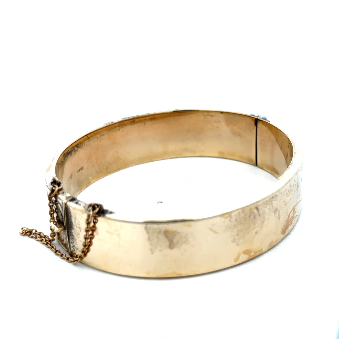 9ct yellow gold bangle weighing 22.7g with smooth polished finish, crafted by Reeves and Sons.