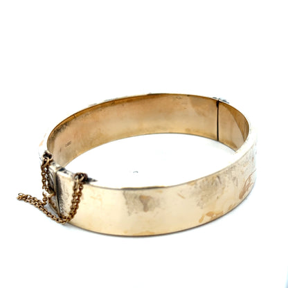 9ct yellow gold bangle weighing 22.7g with smooth polished finish, crafted by Reeves and Sons.