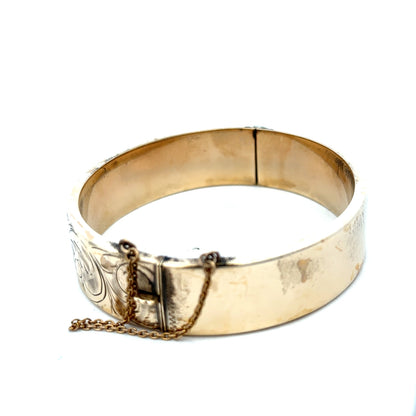 9ct yellow gold bangle with a smooth, polished finish, weighing 22.7g, crafted by Reeves and Sons.