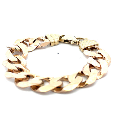 9ct yellow gold curb bracelet weighing 63.6g, featuring classic linked chain design from Reeves and Sons.