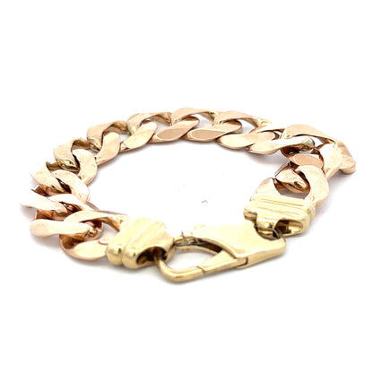 9ct yellow gold curb bracelet weighing 63.6g, featuring a classic chain design, from Reeves and Sons.