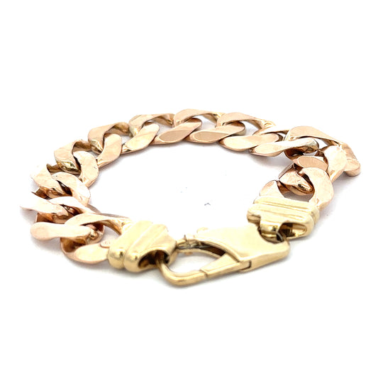 9ct yellow gold curb bracelet weighing 63.6g, featuring a classic chain design, from Reeves and Sons.