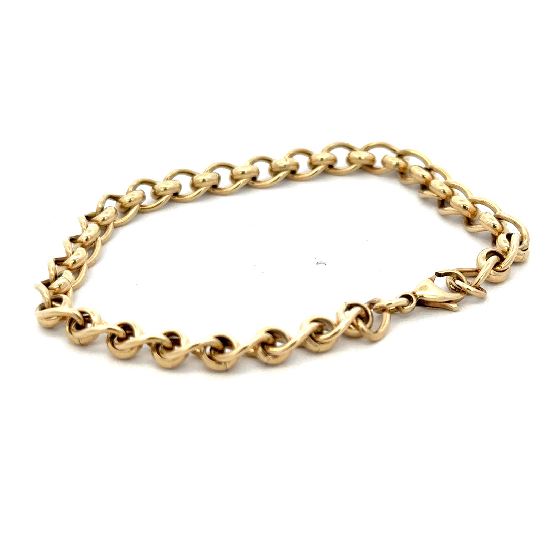 9ct yellow gold rollerball bracelet with a polished finish, weighing 13.2 grams, by Reeves and Sons.