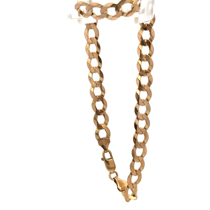 9ct yellow gold curb bracelet weighing 7.7g with woven links, crafted by Reeves and Sons, shown in close-up detail.