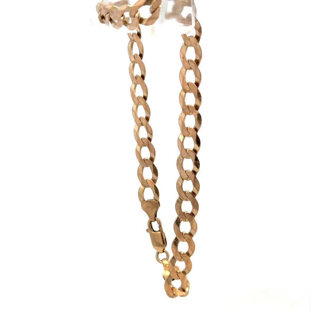 9ct yellow gold curb bracelet with a polished finish, weighing 7.7 grams, from Reeves and Sons.