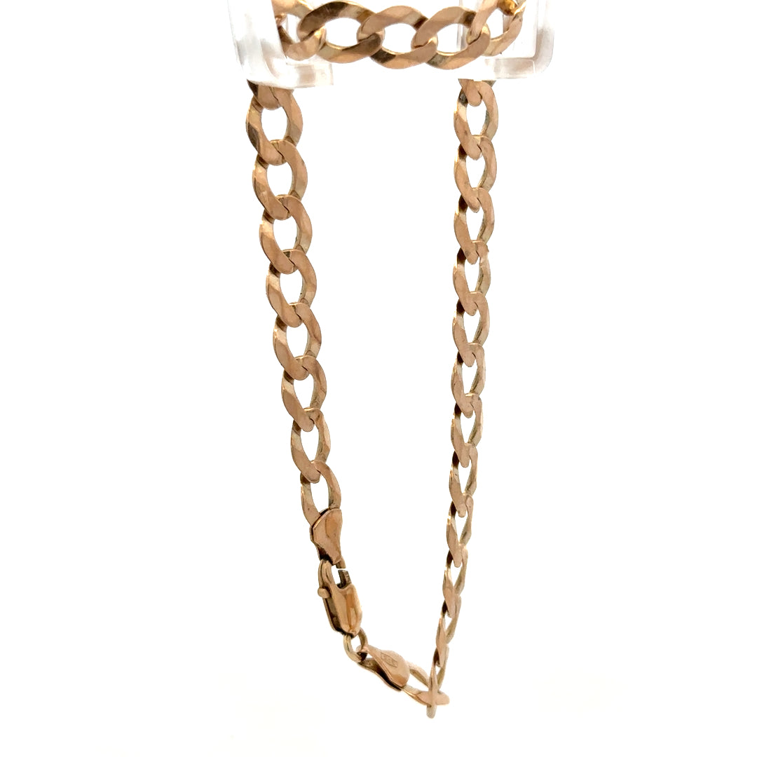 9ct yellow gold curb bracelet with secure clasp, weight 7.7g, from Reeves and Sons, shown on a white background.