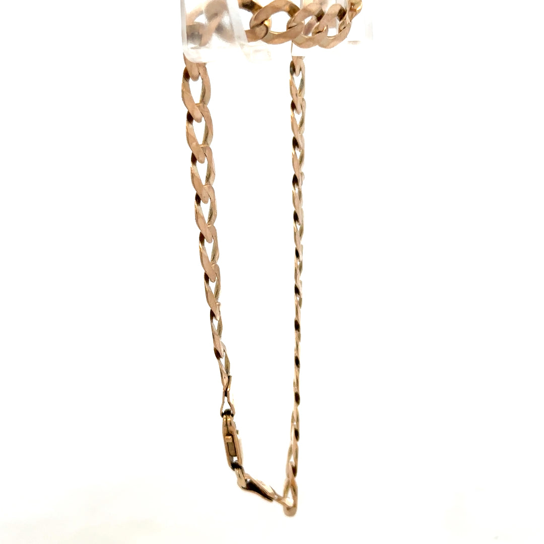 9ct yellow gold curb bracelet weighing 7.7g, featuring linked chain design, styled with a polished finish.