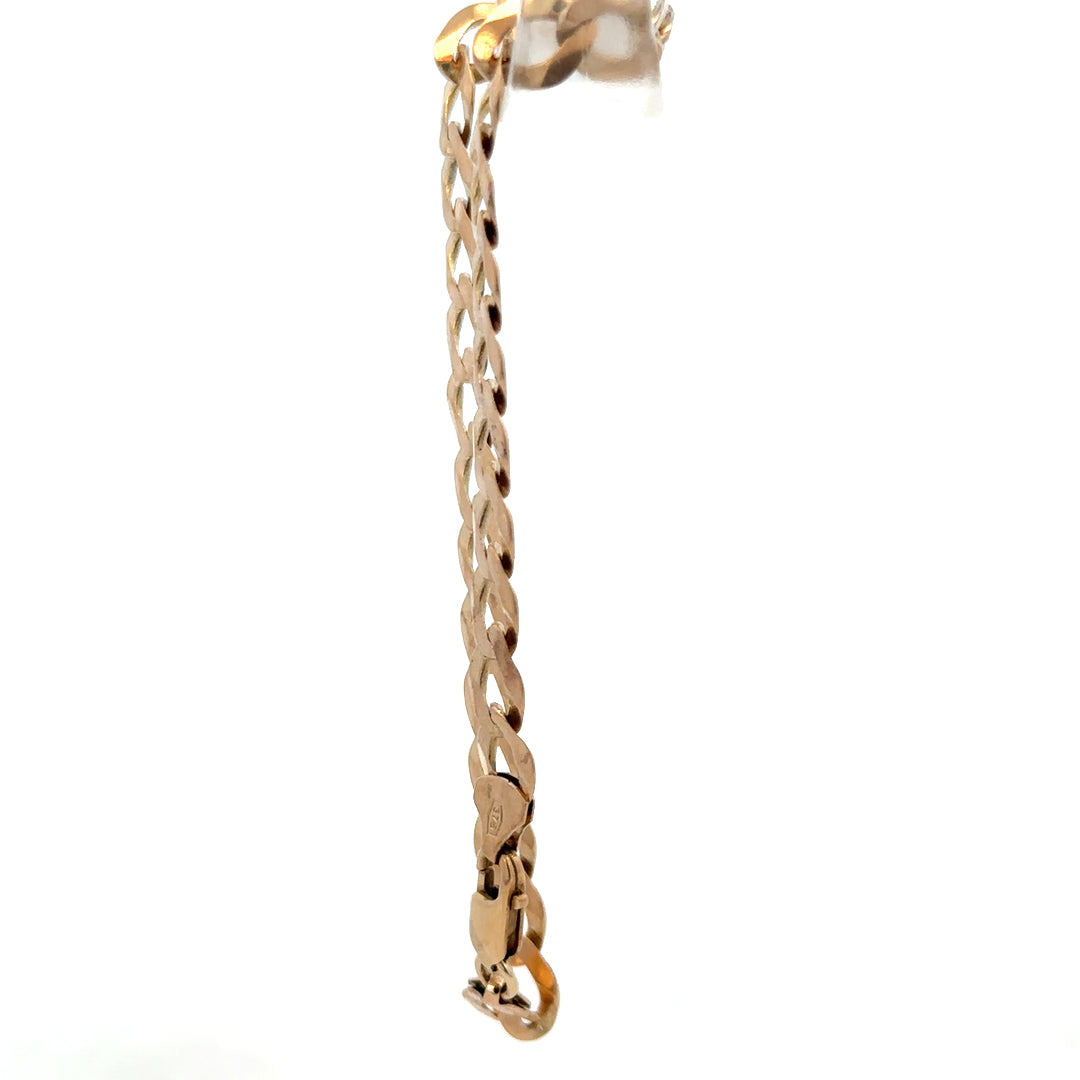9ct yellow gold curb bracelet weighing 7.7g with a classic link design, crafted by Reeves and Sons.