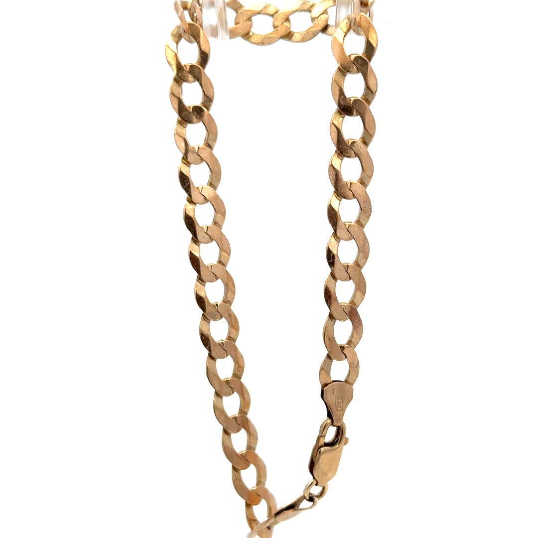 9ct yellow gold curb bracelet weighing 7.7g by Reeves and Sons, featuring polished interlinked chain design.