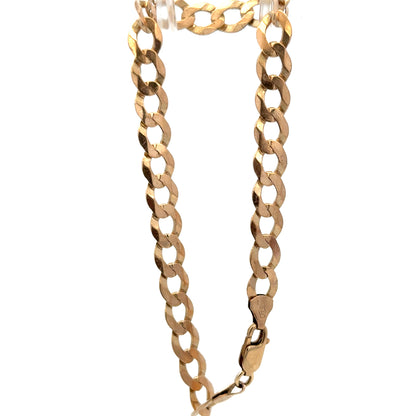 9ct yellow gold curb bracelet weighing 7.7g by Reeves and Sons, featuring polished interlinked chain design.