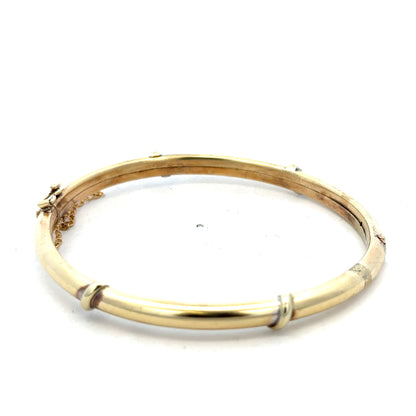9ct yellow gold bangle weighing 11.1g, Reeves and Sons jewelry, polished smooth finish, circular design shown in the image.
