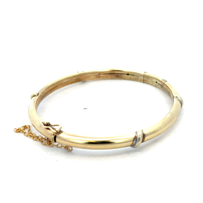 9ct yellow gold bangle weighing 11.1g with a smooth, polished finish, featuring a classic circular design.