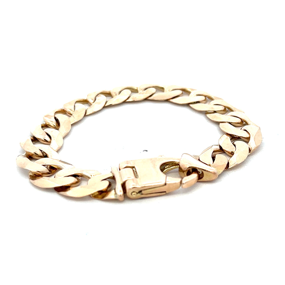 9ct yellow gold curb bracelet weighing 48.1g, crafted by Reeves and Sons, displayed on a neutral background.