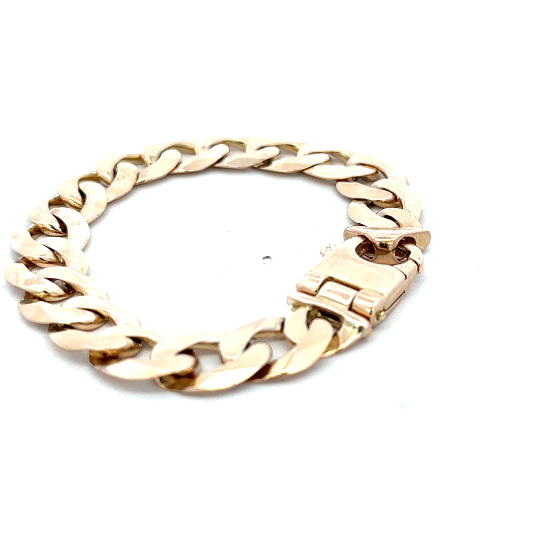 9ct yellow gold curb bracelet weighing 48.1g with a polished finish, featuring interlinked oval links, by Reeves and Sons