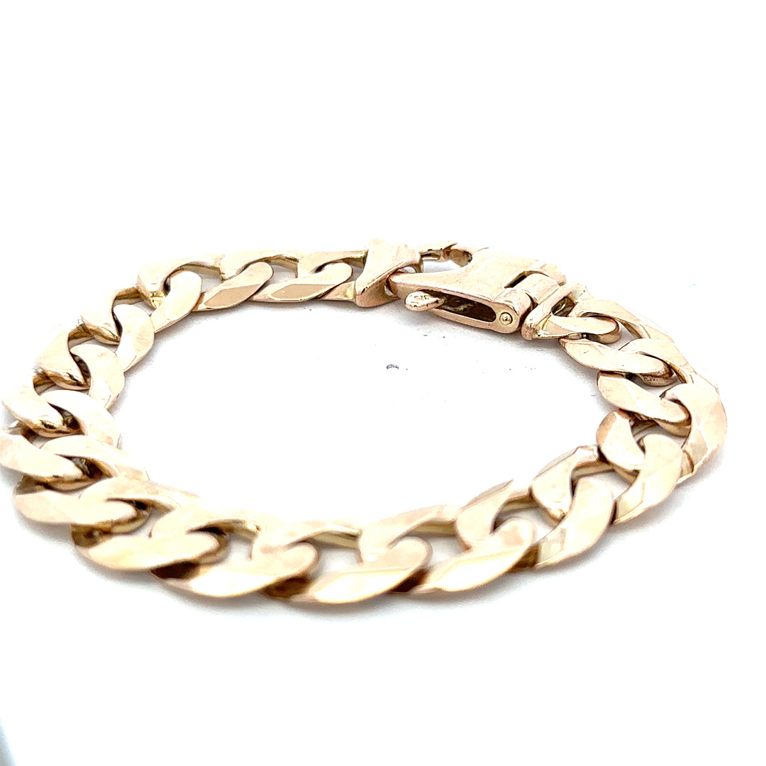 9ct yellow gold curb bracelet weighing 48.1g, featuring a classic chain design from Reeves and Sons.