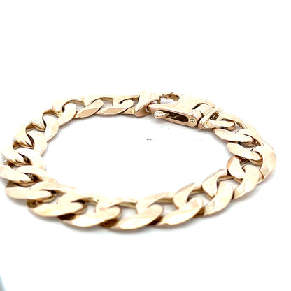 9ct yellow gold curb bracelet weighing 48.1g, featuring a classic chain design from Reeves and Sons.