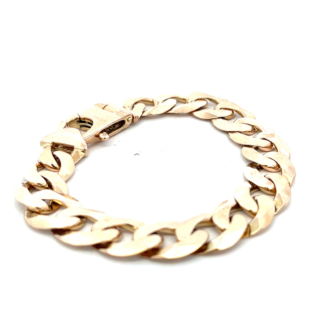 9ct yellow gold curb bracelet weighing 48.1g, featuring a classic chain design, by Reeves and Sons.