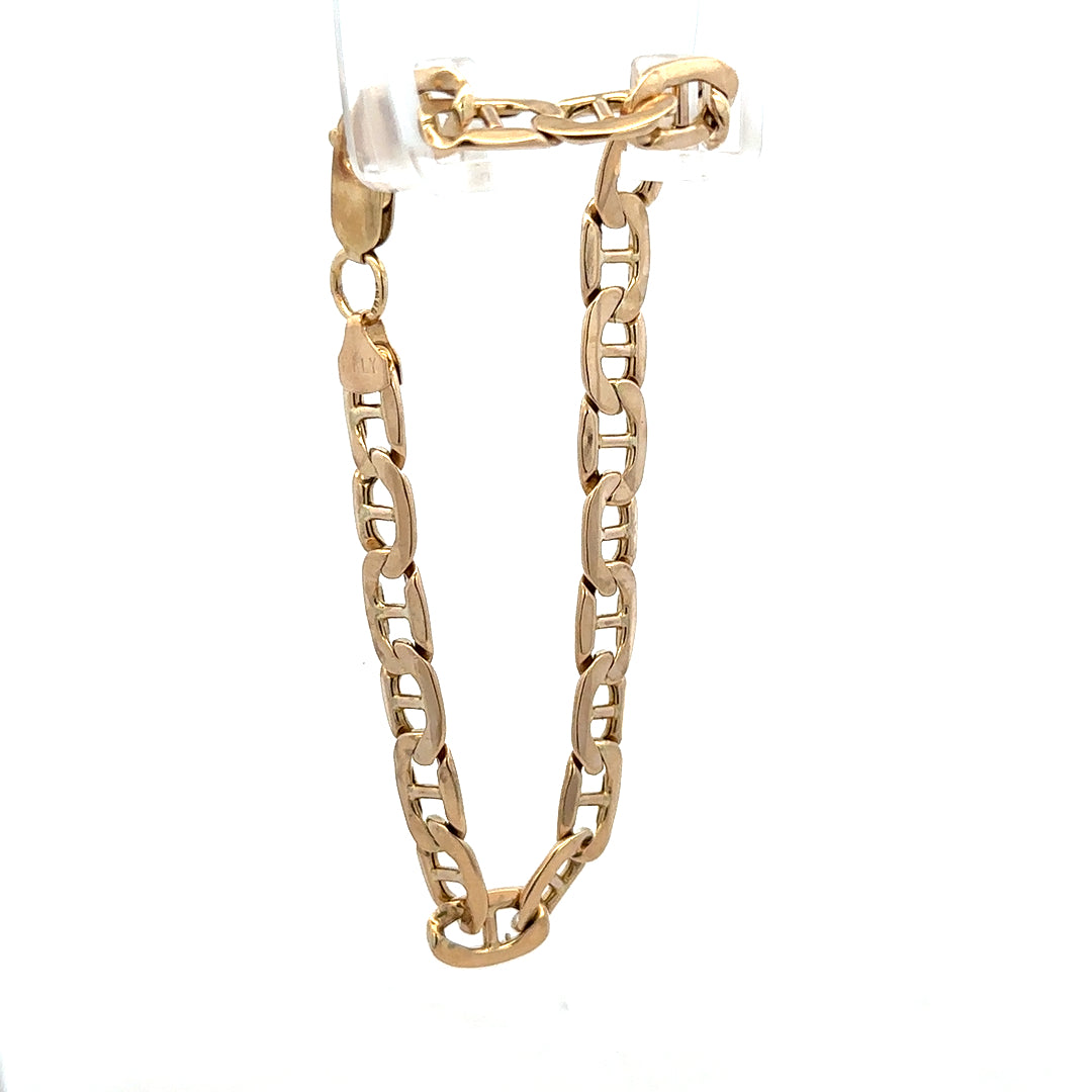 9ct yellow gold bracelet weighing 7.4g, featuring a sleek design from Reeves and Sons, displayed on a neutral background.