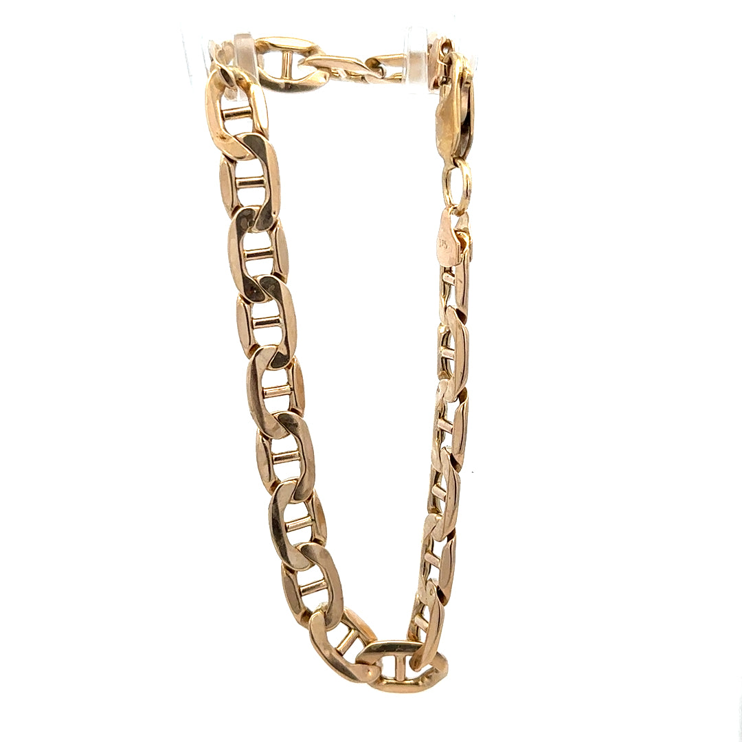 9ct yellow gold bracelet weighing 7.4g with a classic chain design, crafted by Reeves and Sons.