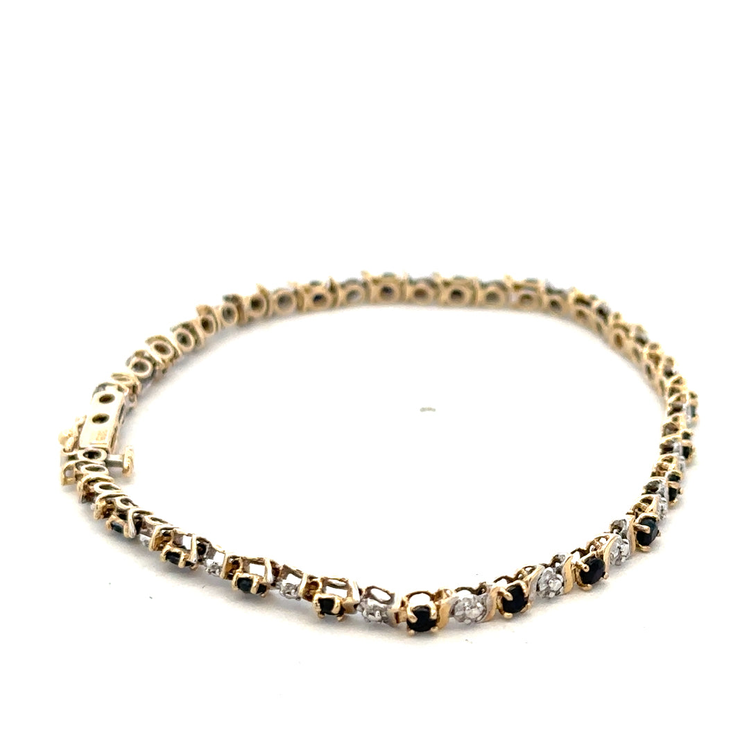 9ct yellow gold sapphire and diamond bracelet with intricate design, weighing 4.8g, featuring sparkling gemstones and fine craftsmanship.