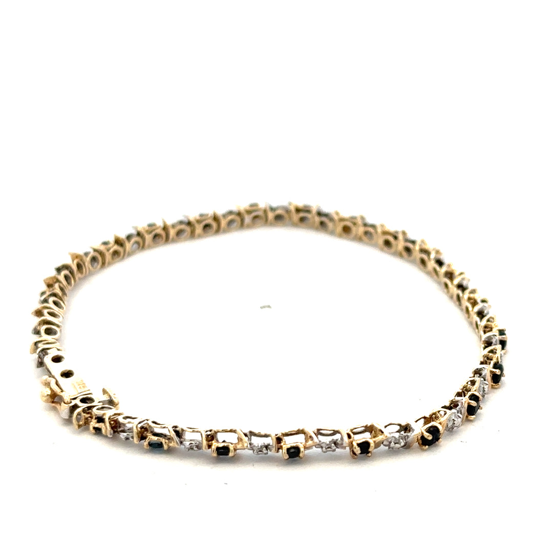 9ct yellow gold sapphire and diamond bracelet by Reeves and Sons, featuring blue sapphires and sparkling diamonds, weight 4.8g