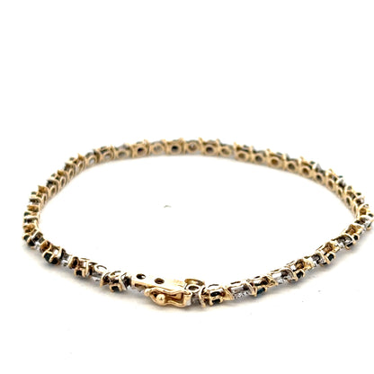 9ct yellow gold sapphire and diamond bracelet by Reeves and Sons, featuring a delicate design with sparkling gemstones.