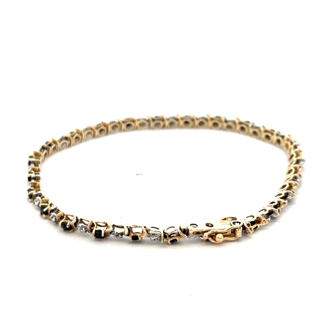 9ct yellow gold sapphire and diamond bracelet by Reeves and Sons, showcasing sparkling gemstones and elegant design.