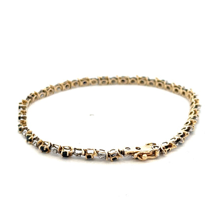 9ct yellow gold sapphire and diamond bracelet by Reeves and Sons, showcasing sparkling gemstones and elegant design.