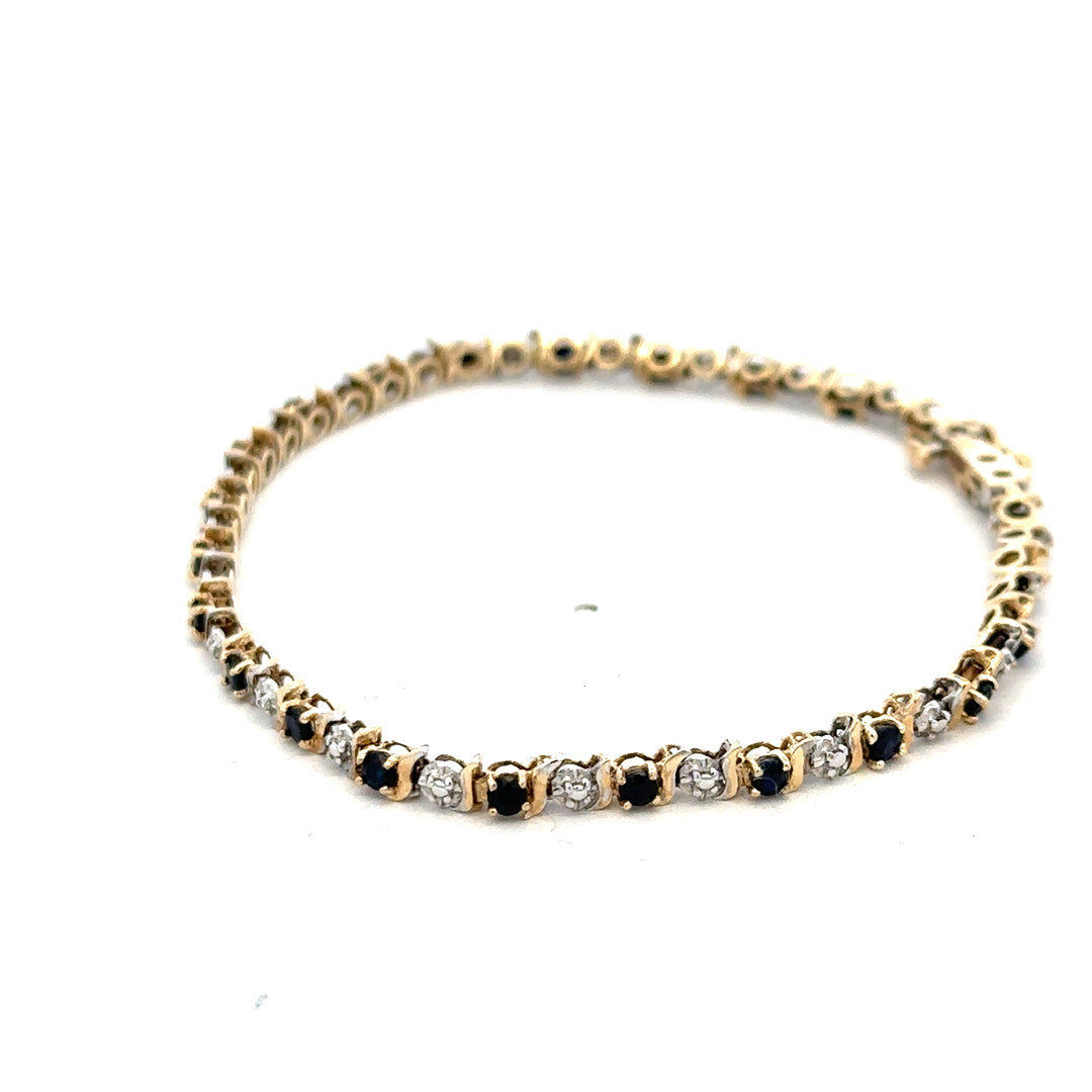9ct yellow gold sapphire and diamond bracelet with intricate design, weighing 4.8g, from Reeves and Sons.