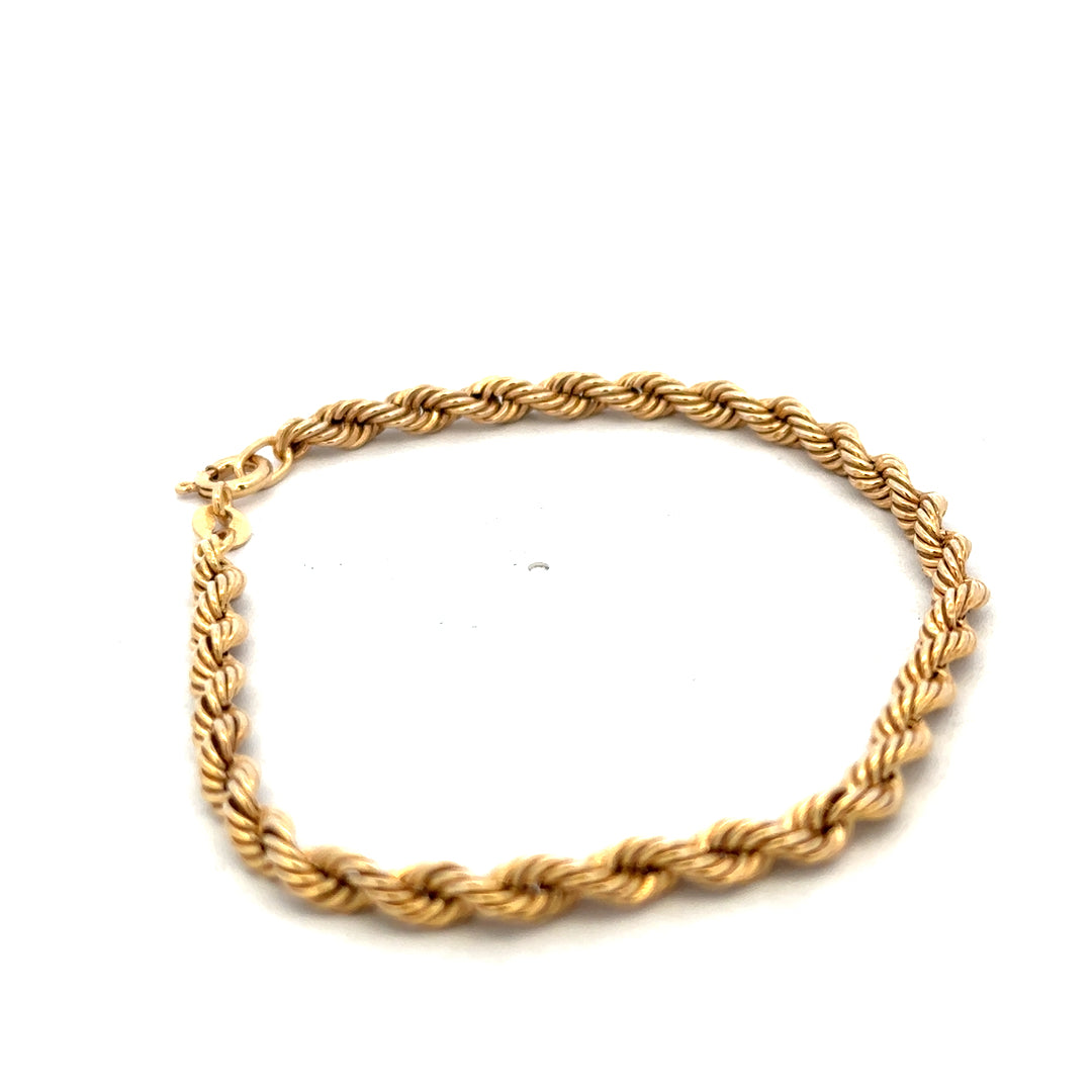 9ct yellow gold rope bracelet weighing 2.4g, featuring twisted gold design, by Reeves and Sons, close-up view of the jewelry.