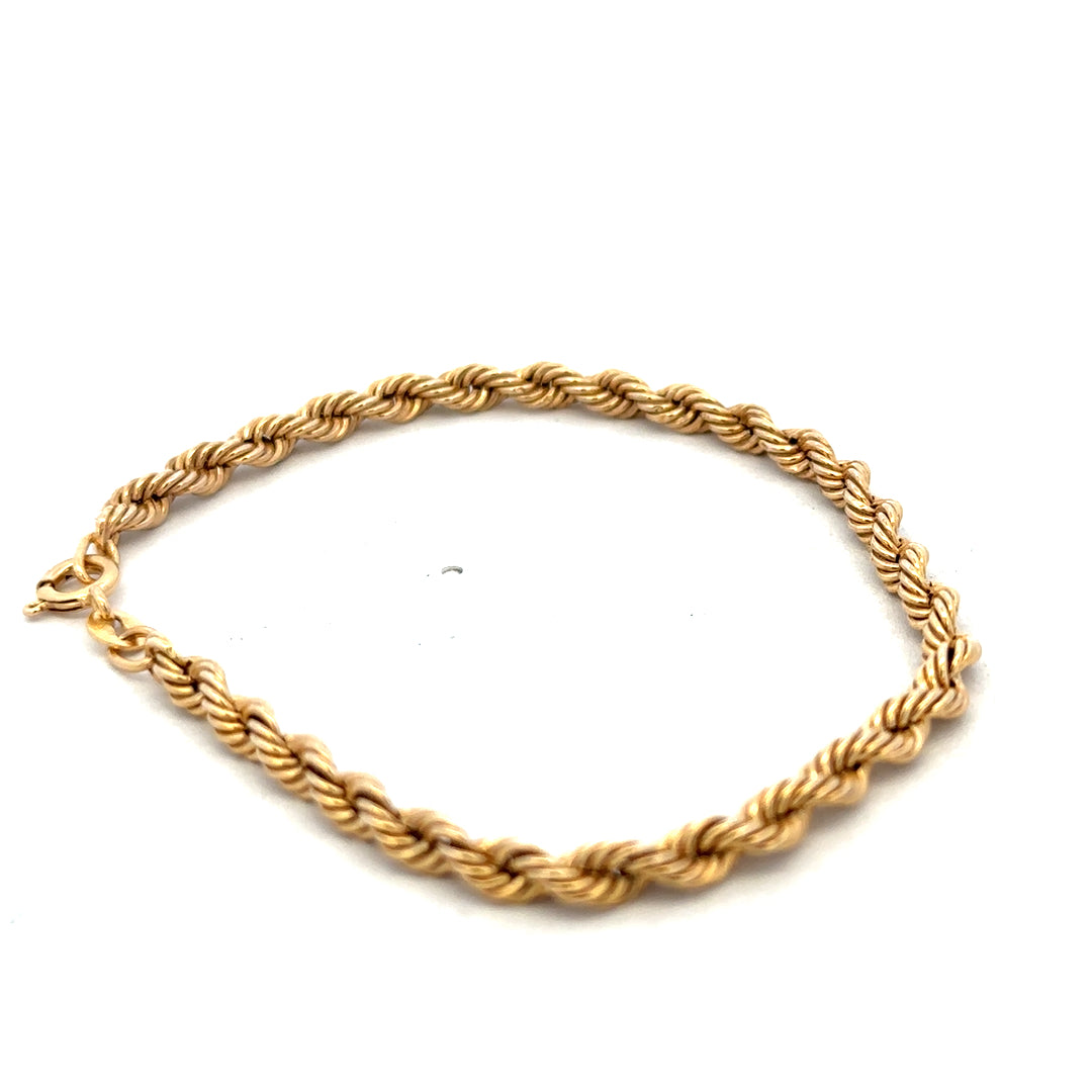 9ct yellow gold rope bracelet weighing 2.4g, featuring a twisted rope design, from Reeves and Sons.
