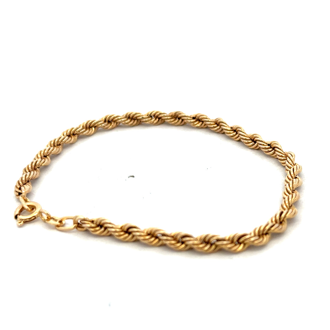 9ct yellow gold rope bracelet weighing 2.4g with intricate twisted design, crafted by Reeves and Sons.