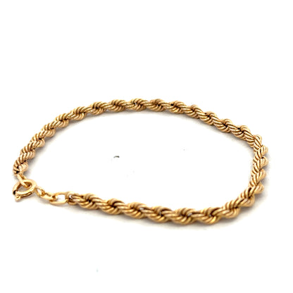 9ct yellow gold rope bracelet weighing 2.4g with intricate twisted design, crafted by Reeves and Sons.